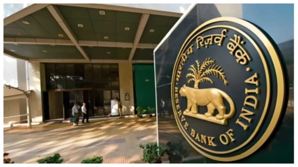 A bank employee checks Indian currency notes using a note authentication and sorting machine at a bank branch after the RBI directed banks in border districts to strengthen counterfeit currency detection.